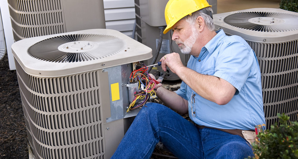 HVAC technician performing repair